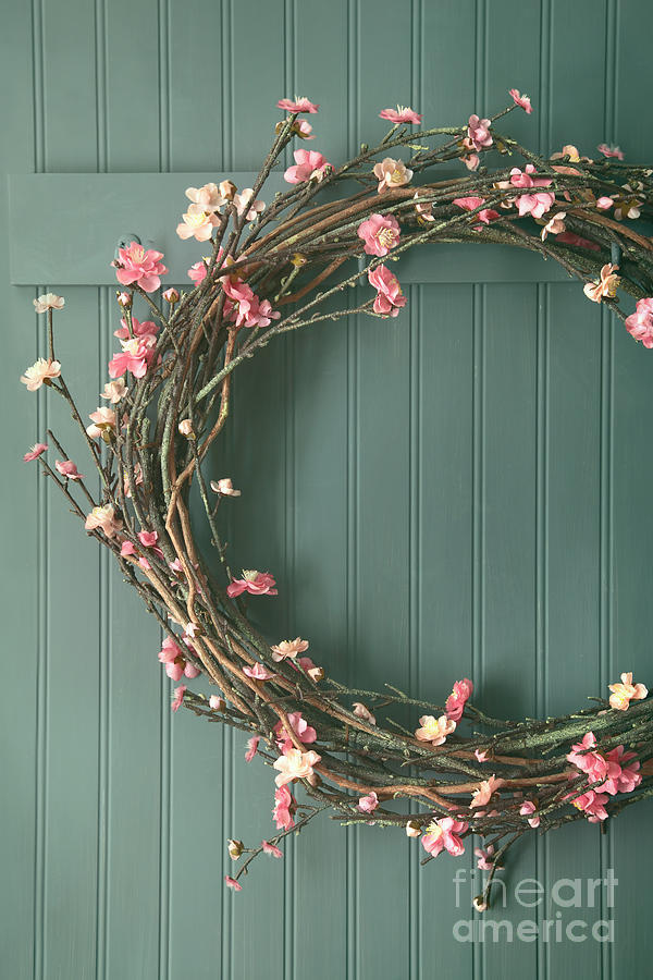 Apple blossom wreath hanging on coat hook #1 Photograph by Sandra Cunningham