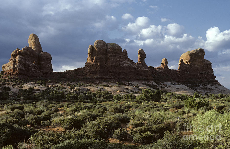 Arches National Park sunrise rock formations  #1 Photograph by Jim Corwin