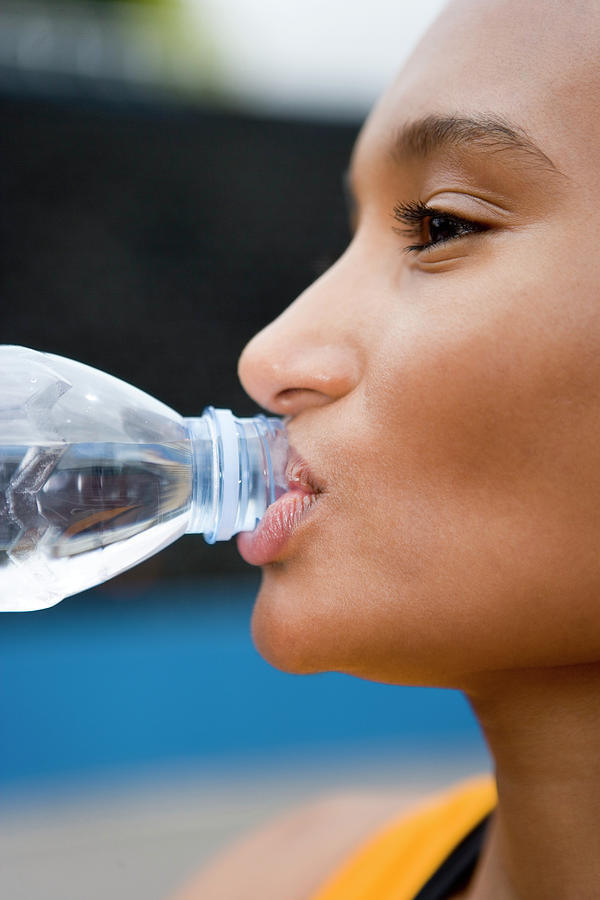 Athlete Drinking Water Photograph by Gustoimages/science Photo Library