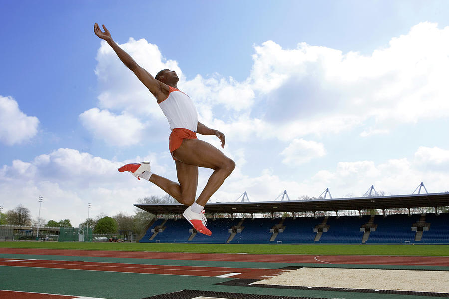 Athlete Performing A Long Jump #1 Photograph by Science Photo Library Athlete Performing A Long Jump #1 Photograph by Science Photo Library
