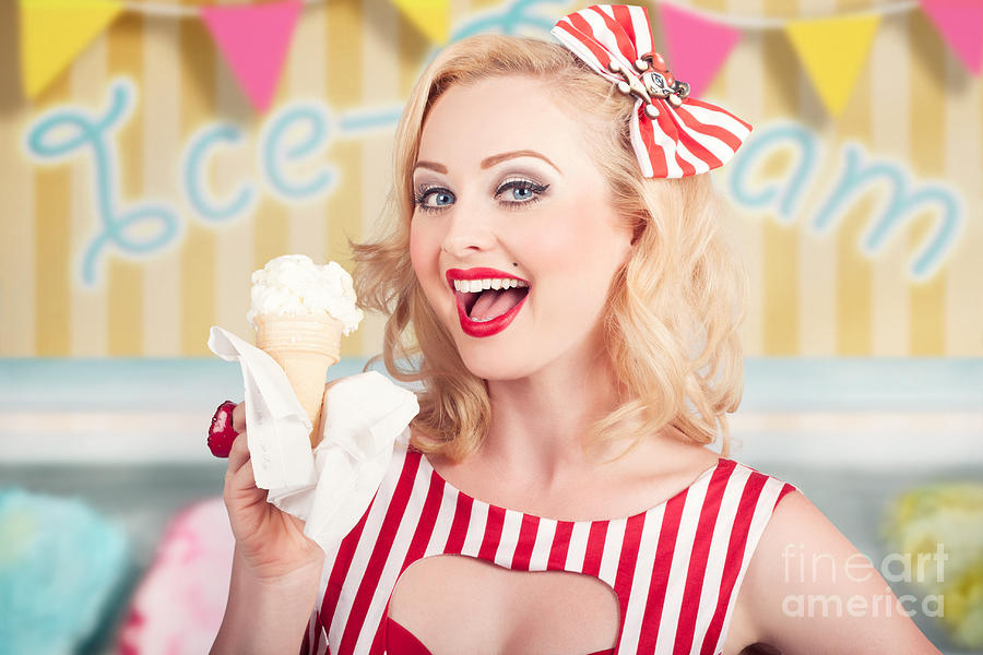 Attractive retro pinup girl eating ice cream cone #1 Photograph by Jorgo Photography