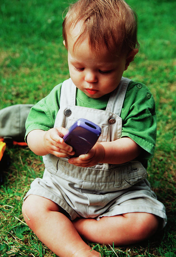 Baby Playing With Mobile Phone #1 Photograph by Tracy Rutter/science Photo Library