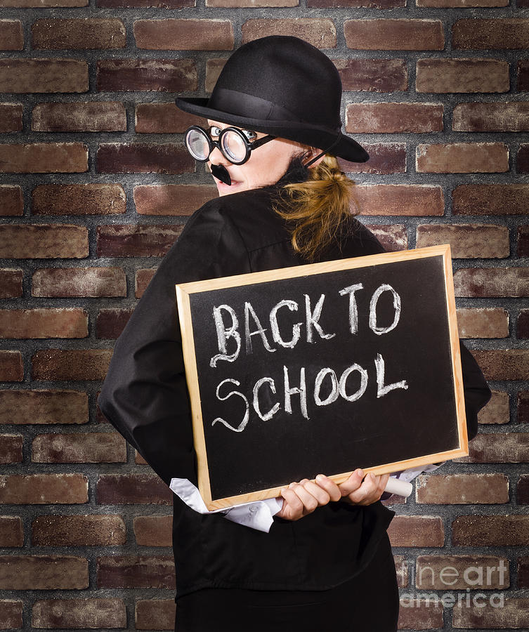 Back to school teacher holding blackboard and chalk Photograph by Jorgo Photography