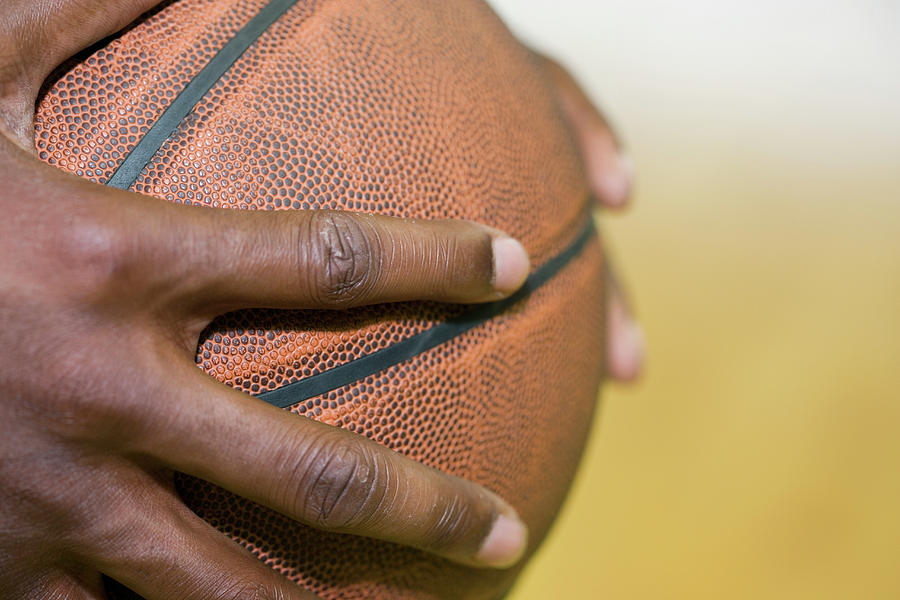 Basketball Player Holding Ball #1 Photograph by Gustoimages/science Photo Library