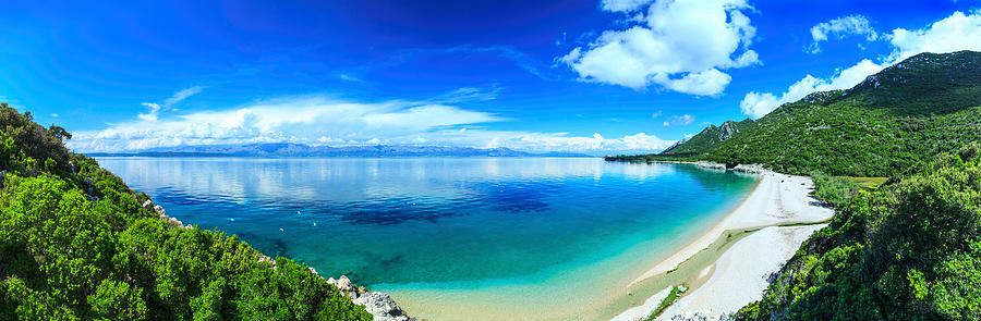 Beach, crystal clear water in Adriatic Sea and Green Mountains #1 Photograph by Konradlew