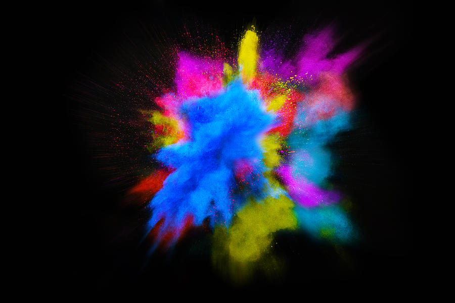 Beautiful powder explosion in all directions with vivid colors and black background. #1 Photograph by Artur Debat