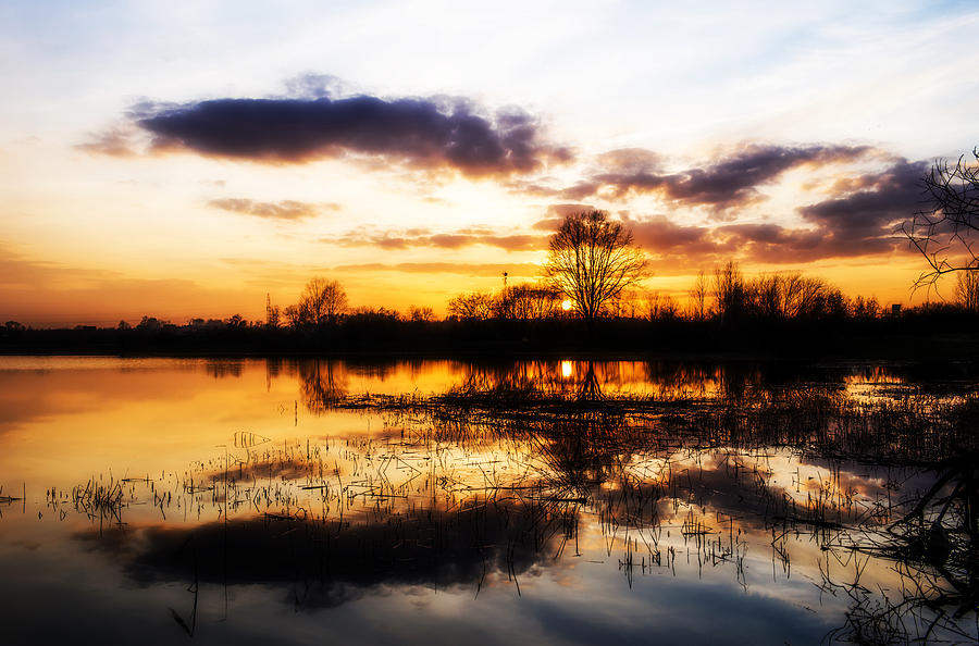 Beautiful sunset reflecting in a lake #1 Photograph by Jaroslaw Grudzinski
