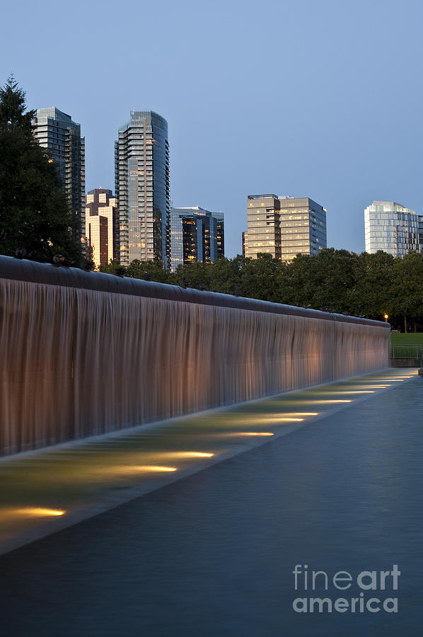 Bellevue skyline from city park with fountain and waterfall at s #1 Photograph by Jim Corwin
