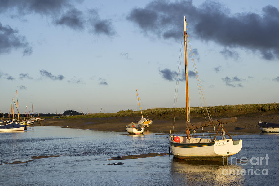 Boats at low tide at Burnham Overy Staithe in the early morning #1 Photograph by Keith Douglas