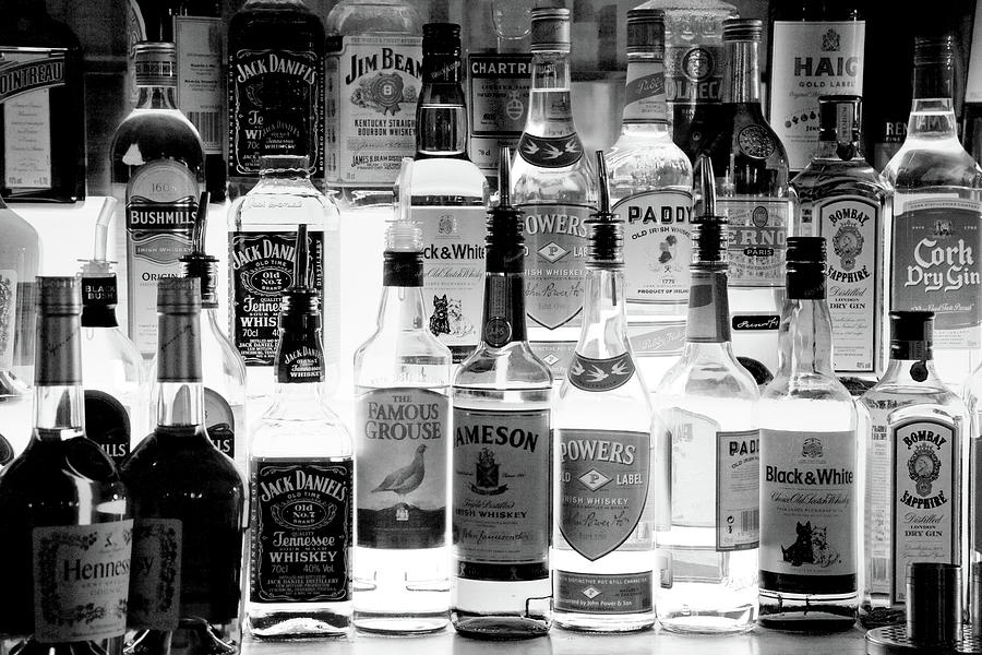 Black And White Photograph - Bottles Of Liquor, De Luans Bar #1 by Panoramic Images