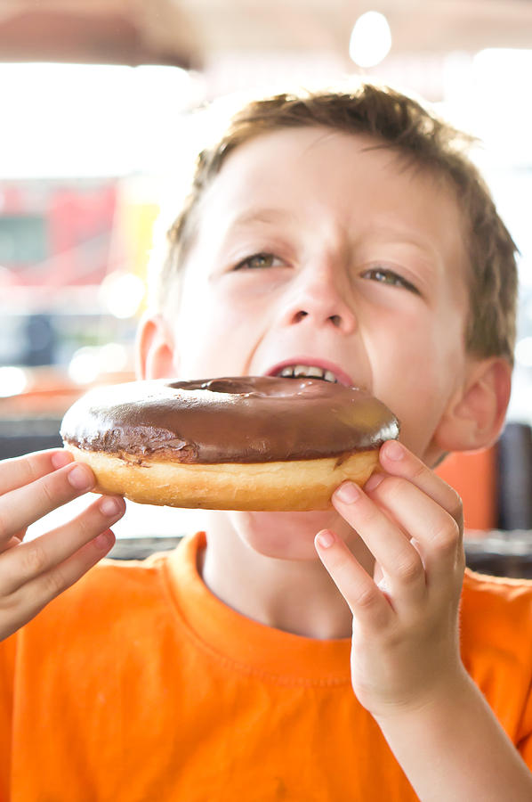 Cake Photograph - Boy with donut #1 by Tom Gowanlock
