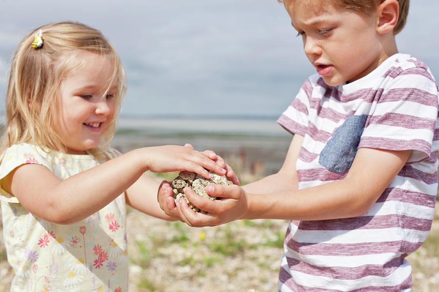 Brother And Sister Collecting Stones #1 Photograph by Science Photo Library Brother And Sister Collecting Stones #1 Photograph by Science Photo Library