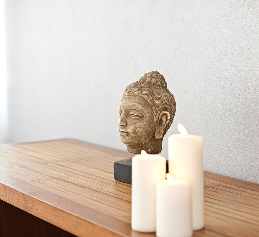 Buddha head in front of a grey wall #1 Photograph by U Schade