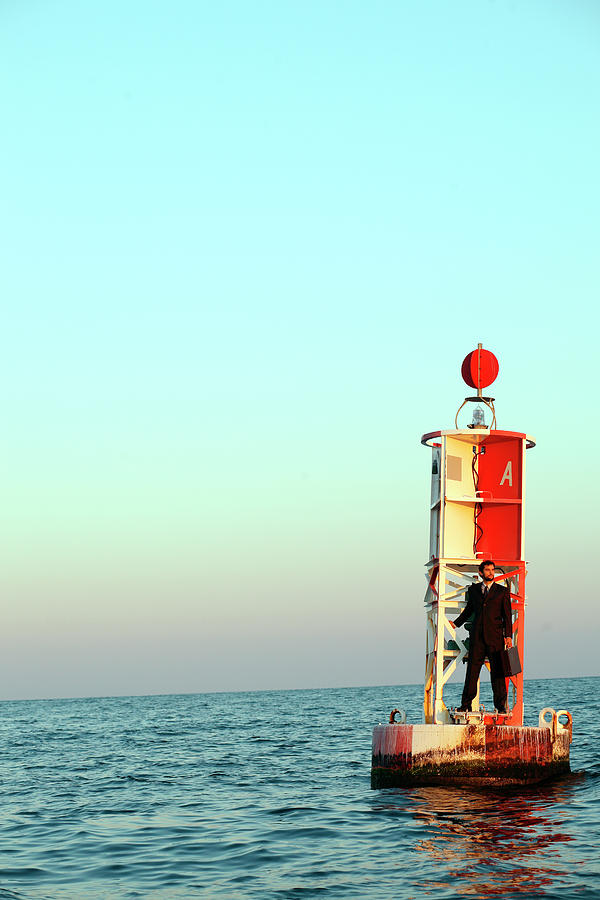 Business Man On A Buoy Photograph by Logan Mock-Bunting | Fine Art America