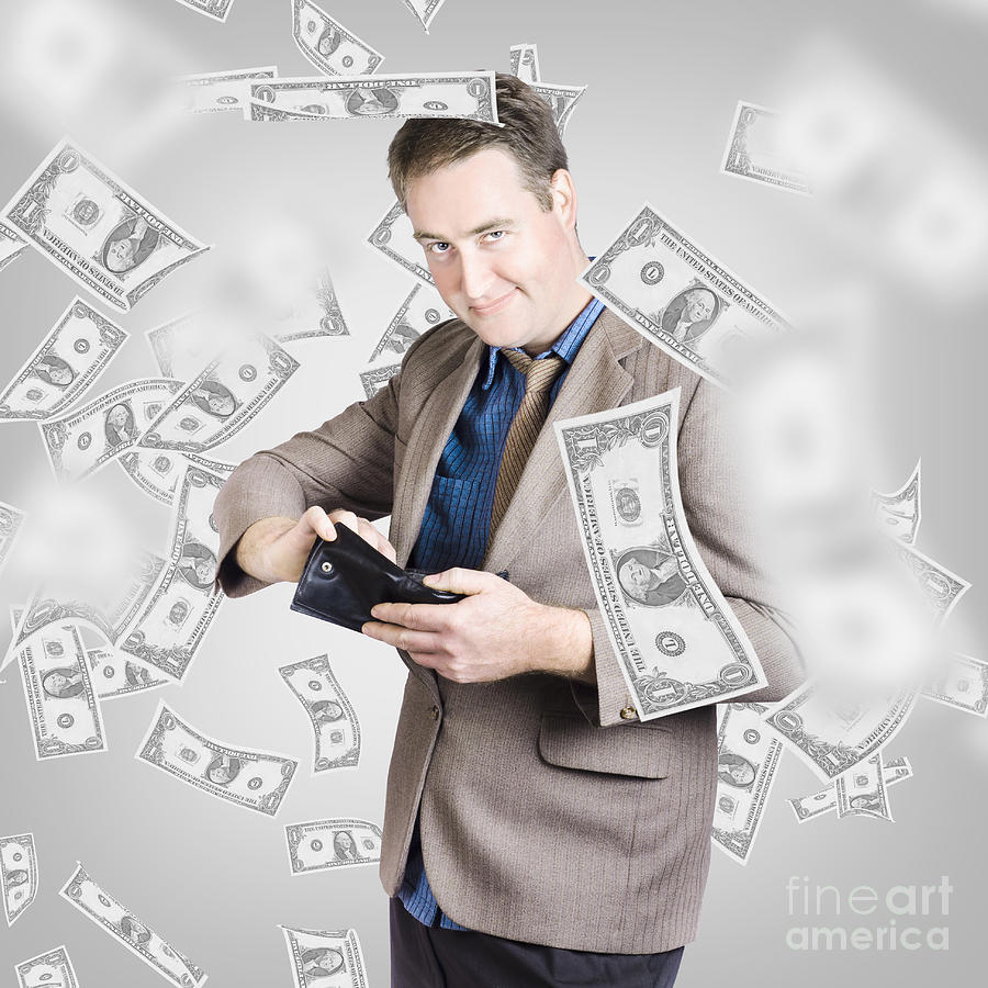Businessman under falling money. Financial success #1 Photograph by Jorgo Photography