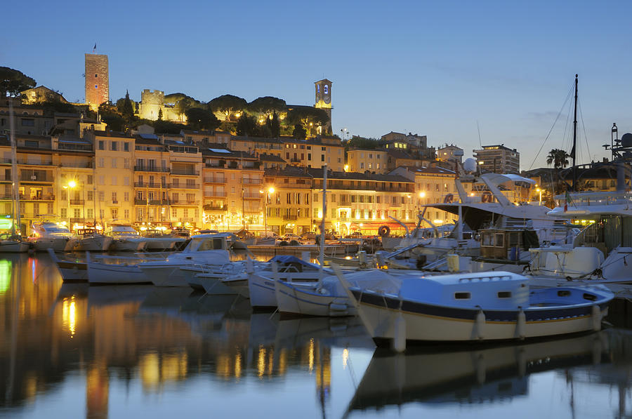 Cannes in the evening viewed from harbor #1 Photograph by Nikitje