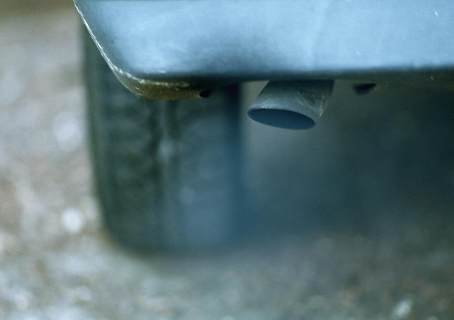 Car exhaust pipe, close-up. #1 Photograph by James Hardy