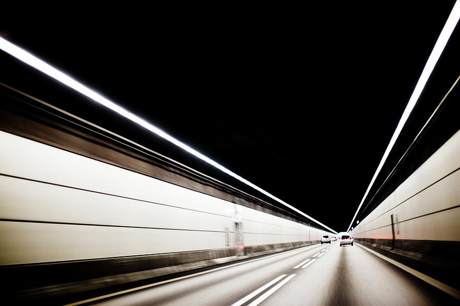 Cars Driving Through Tunnel Photograph by Johner Images