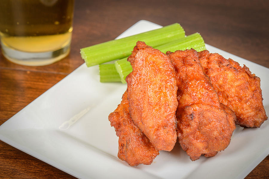 Chicken Buffalo Wings With Celery Sticks And Beer Photograph
