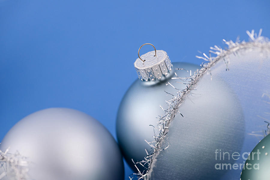Christmas Photograph - Christmas baubles on blue 1 by Elena Elisseeva