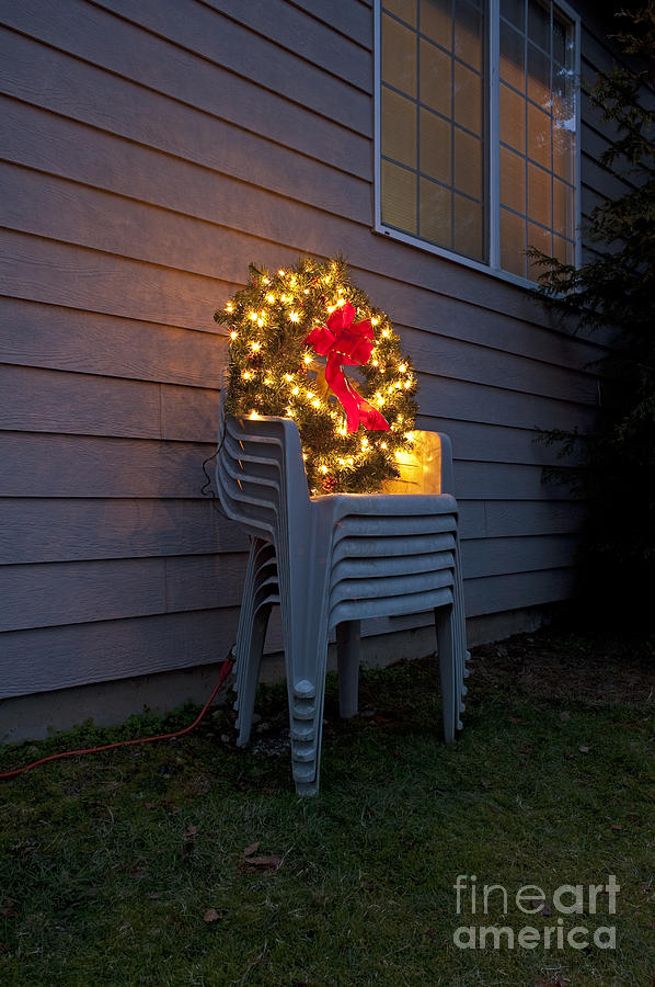 Christmas wreath on lawn chairs #1 Photograph by Jim Corwin