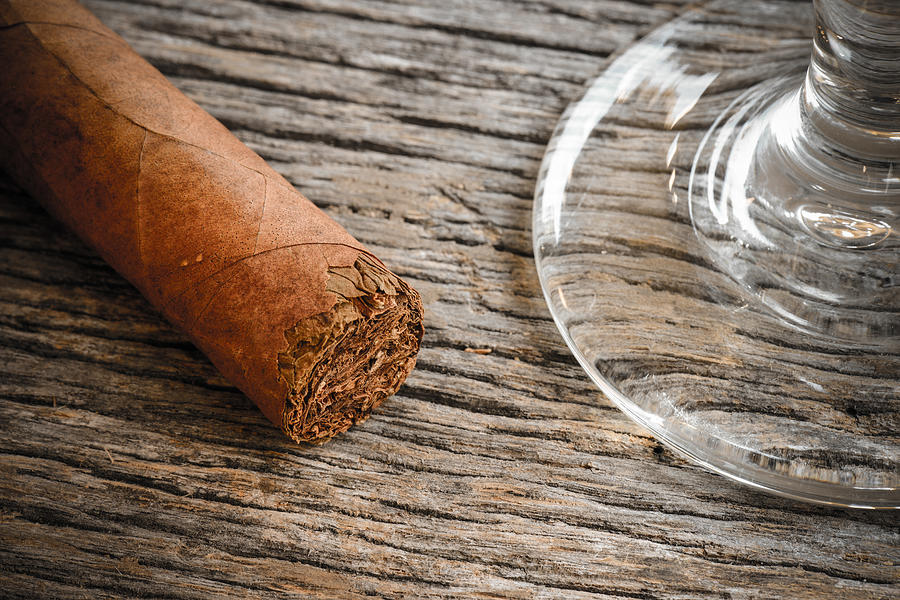 Cigar with Glass of Brandy or Whiskey on Wooden Background #1 Photograph by Brandon Bourdages