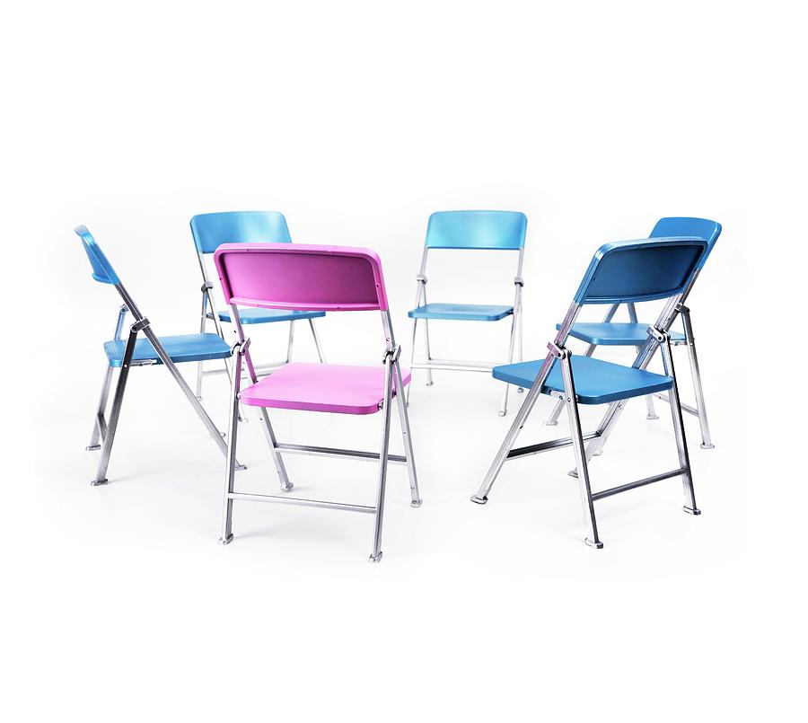 Circle Of Blue Chairs With One Pink Chair Photograph by Cordelia Molloy/science Photo Library