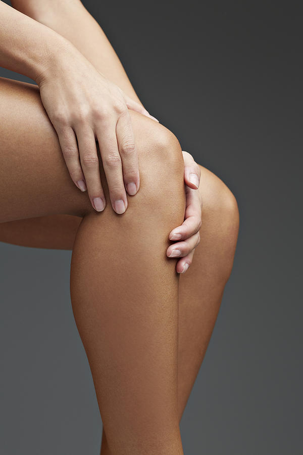 Close up of woman having knee pain #1 Photograph by Klaus Vedfelt