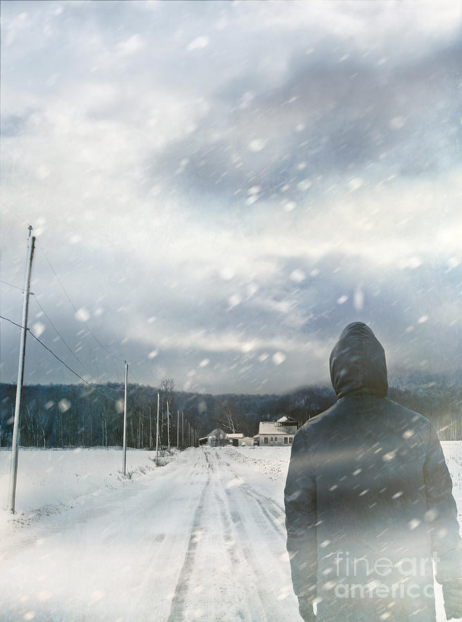 Closeup of man walking on snowy winter road #1 Photograph by Sandra Cunningham