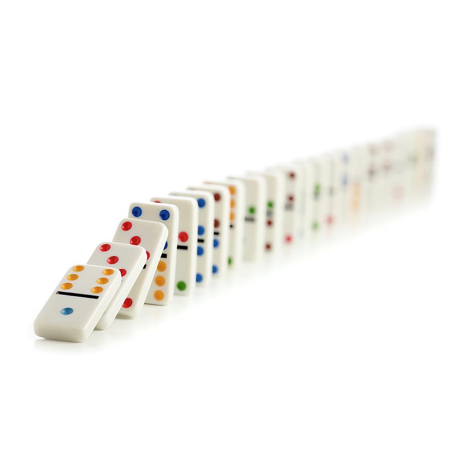 Colourful Dominoes Falling Down #1 Photograph by Science Photo Library