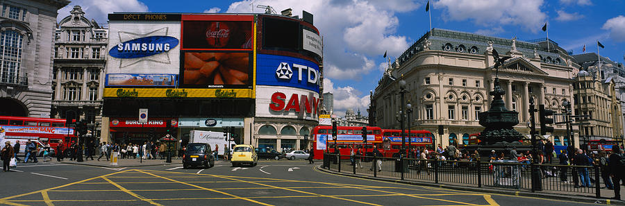 Commercial Signs On Buildings #1 Photograph by Panoramic Images
