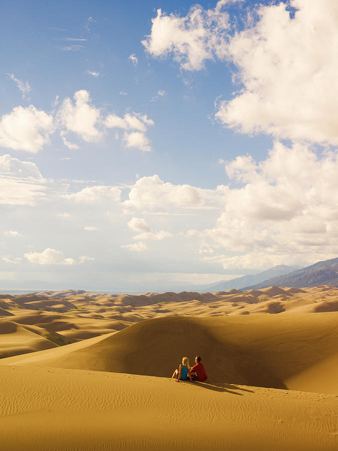 Couple @ Great Sand Dunes Np Photograph by Glenn Oakley - Pixels