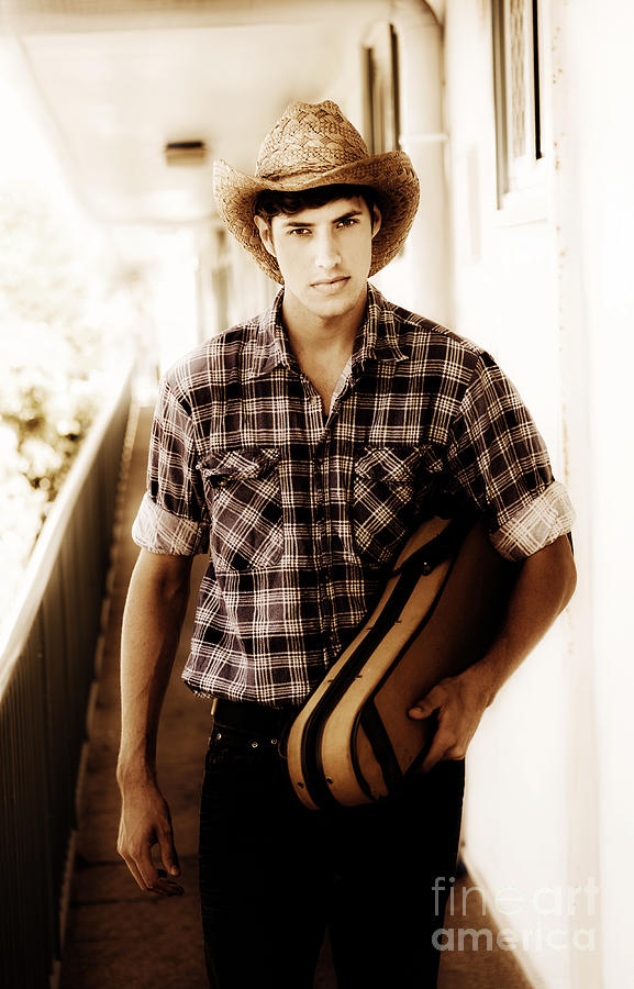 Cowboy Carrying Guitar Photograph by Jorgo Photography