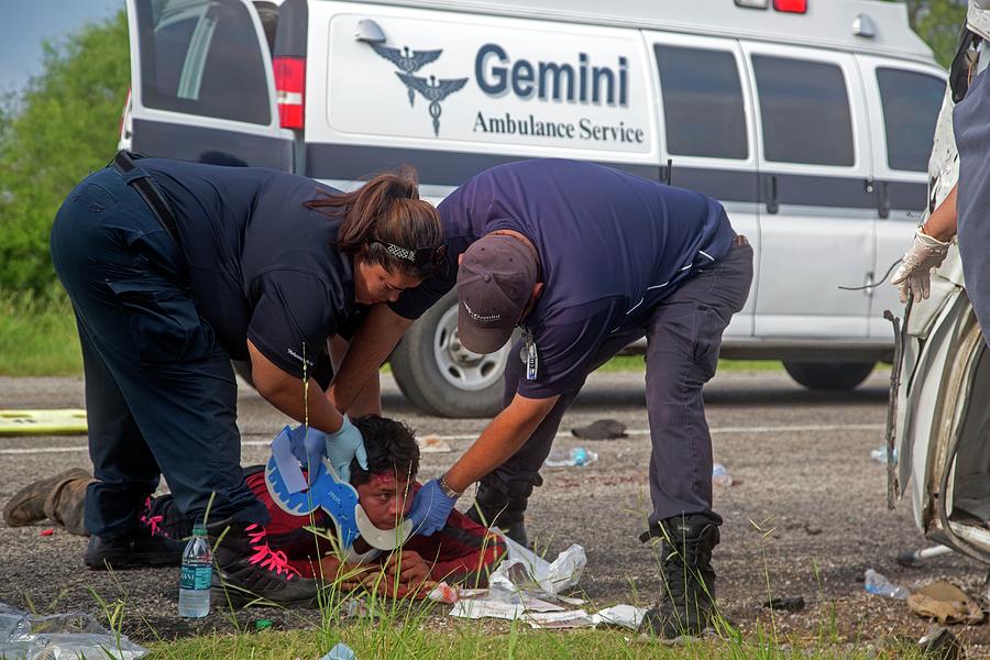 Human Photograph - Crash Victim Being Treated #1 by Jim West