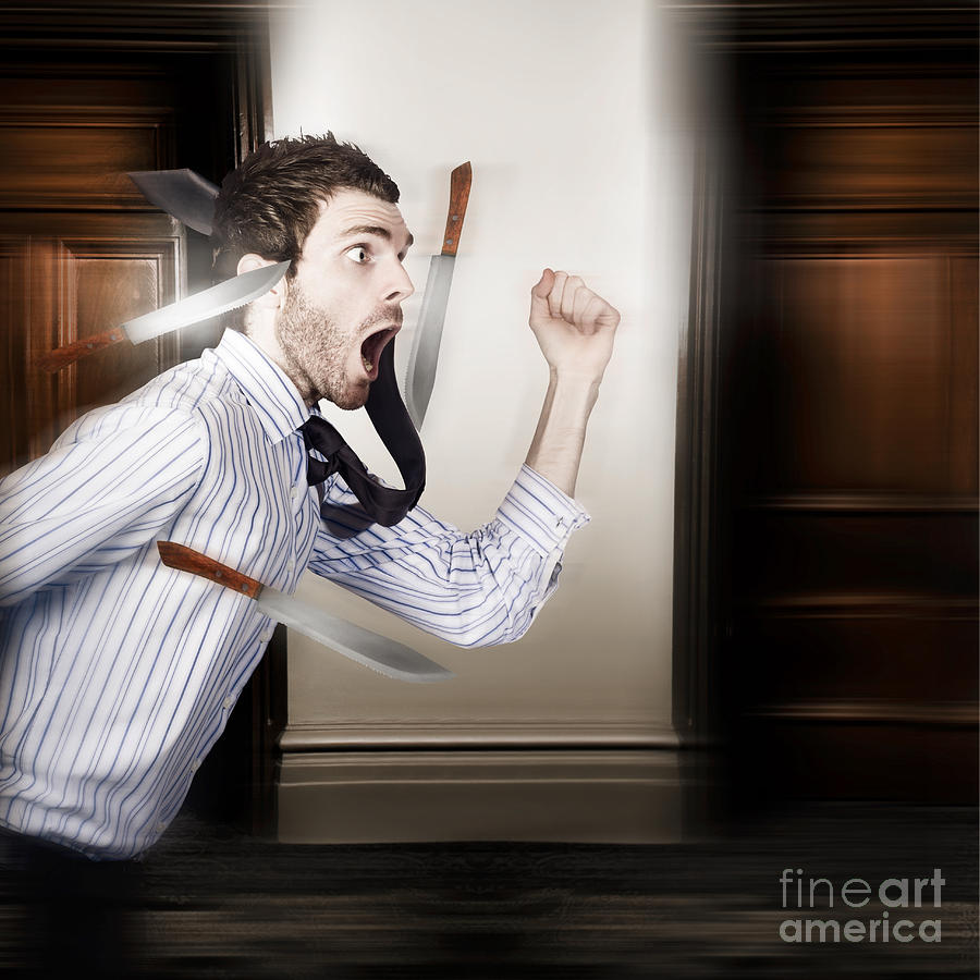 Crazy businessman running in fear from danger #1 Photograph by Jorgo Photography