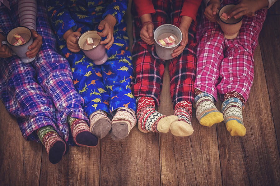 Cute Little Kids in Pyjamas and Christmas Socks Drinking Hot Chocolate with Marshmallows for Christmas #1 Photograph by GMVozd