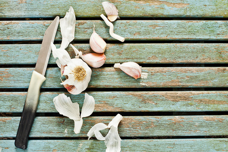 Knife Still Life Photograph - Cutting garlic #1 by Tom Gowanlock