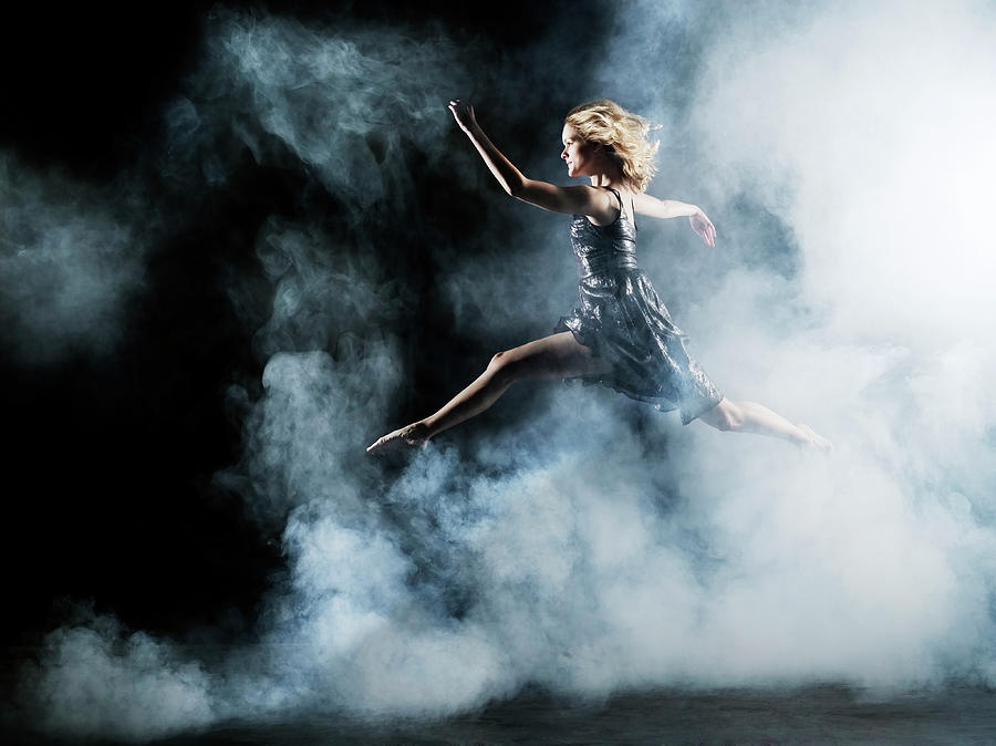 Dancer Leaping Through Smoke Photograph by Henrik Sorensen