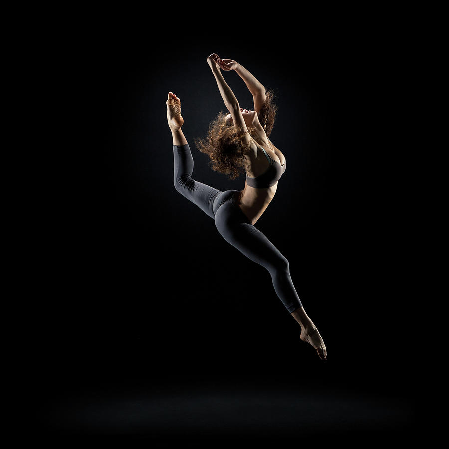 Dancer Pose On Black Background #1 Photograph by Zonecreative
