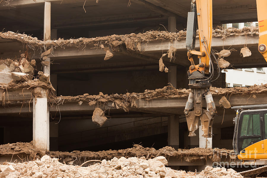 Destruction Of Concrete Building With Equipment Photograph