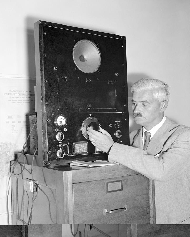 Diplomat listens to radio broadcast, Photograph by Science Photo ...