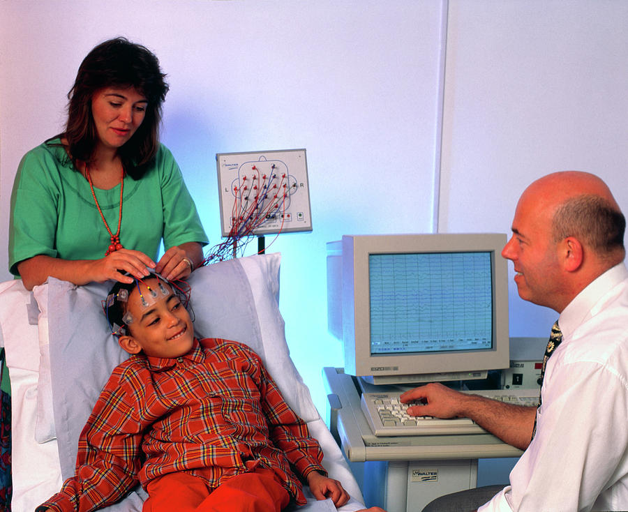 Doctor Monitors Boys Brain Activity By Eeg #1 Photograph by Science Photo Library