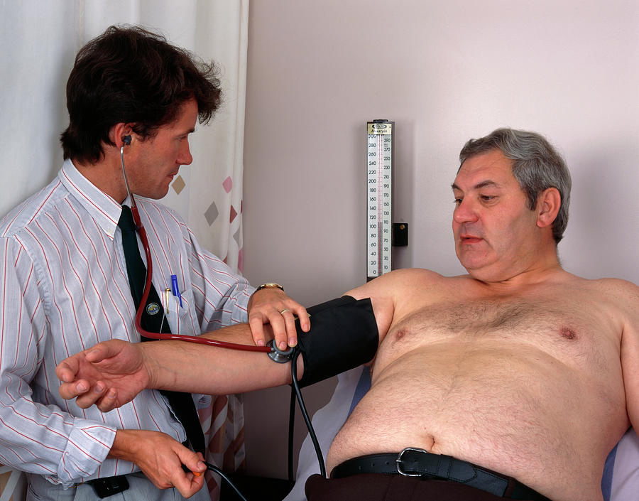 Blood Pressure Photograph - Doctor Takes The Blood Pressure Of An Obese Man #1 by Simon Fraser/science Photo Library
