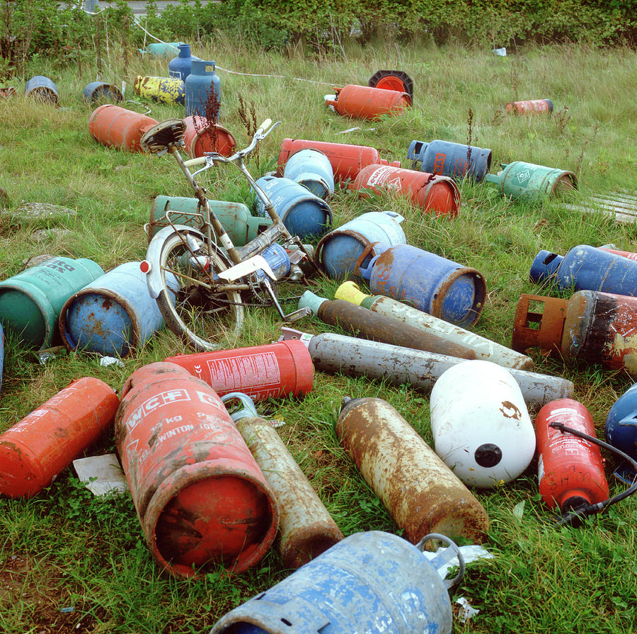 Dumped Gas Canisters Photograph by Robert Brook/science Photo Library