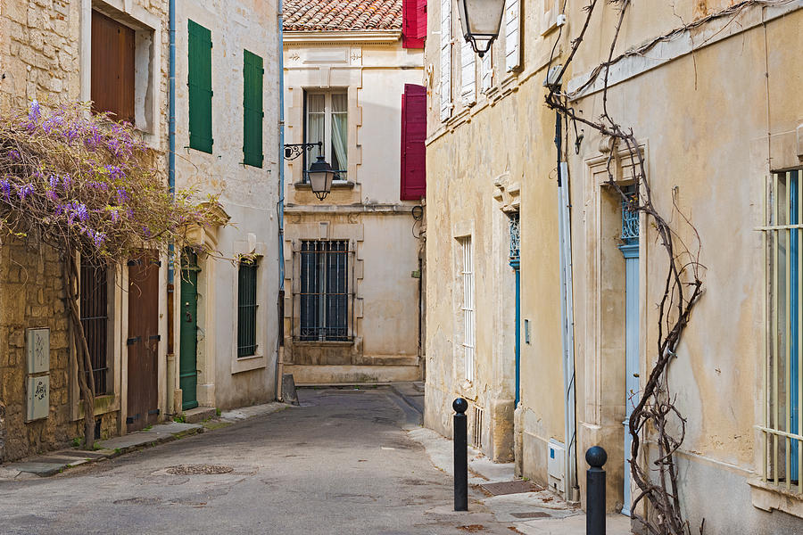 Early morning view at the street in old city of  Arles France #1 Photograph by Marek Poplawski