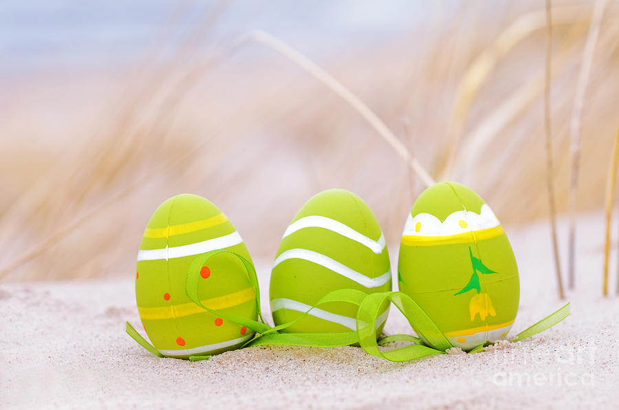 Easter decorated eggs on sand #1 Photograph by Michal Bednarek