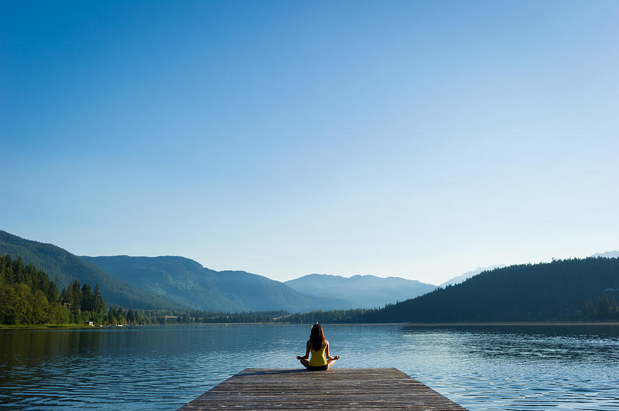 Easy Pose Tranquil Lakeside meditation at sunrise #1 Photograph by stockstudioX