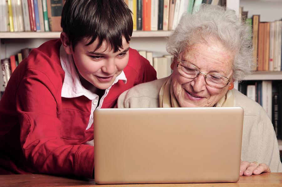 Elderly Lady Learning To Use A Laptop #1 Photograph by Mauro Fermariello/science Photo Library