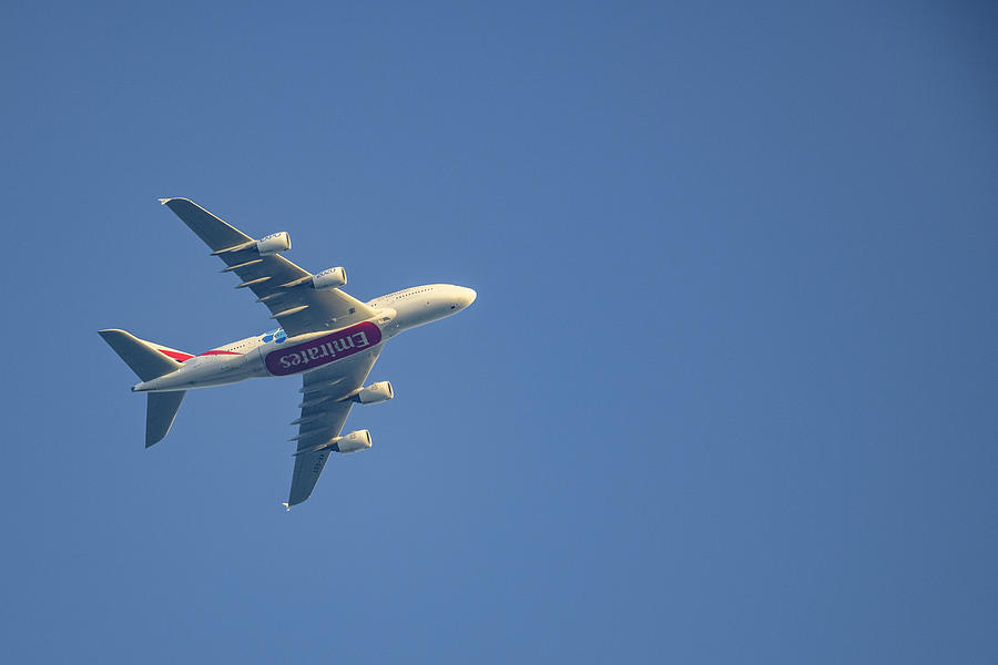 Emirates Airline Airbus A380 flying high up in the air. #1 Photograph by Sjo