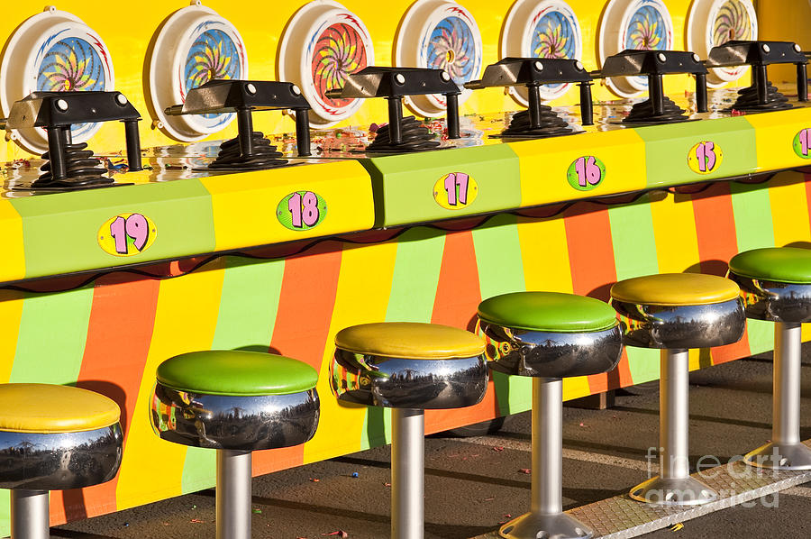 Evergreen State Fair Midway Game With Coloful Stools And Squirt Photograph